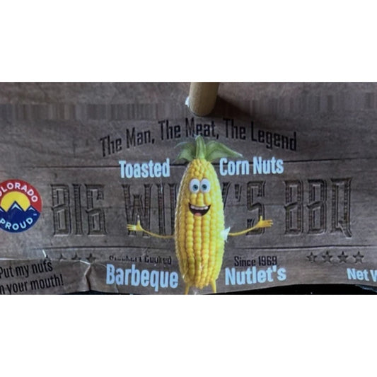 Corn nut packaging with cartoon corn character and branding text on a cardboard background. Colorado craft corn nuts, tender crunch corn nuts.