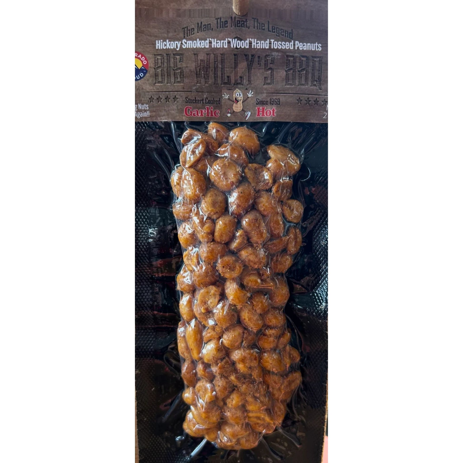 Packaged peanuts with a brand label on a white background. Colorado crafted peanuts, spicy peanuts