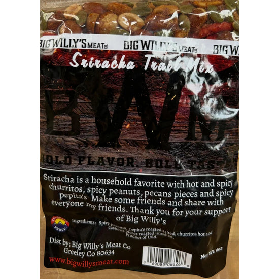 Packaged snack mix with visible branding on a wooden surface. Spicy Nut Snack Mix, Gourmet Spicy Snacks, Spicy Pepitas and Peanuts