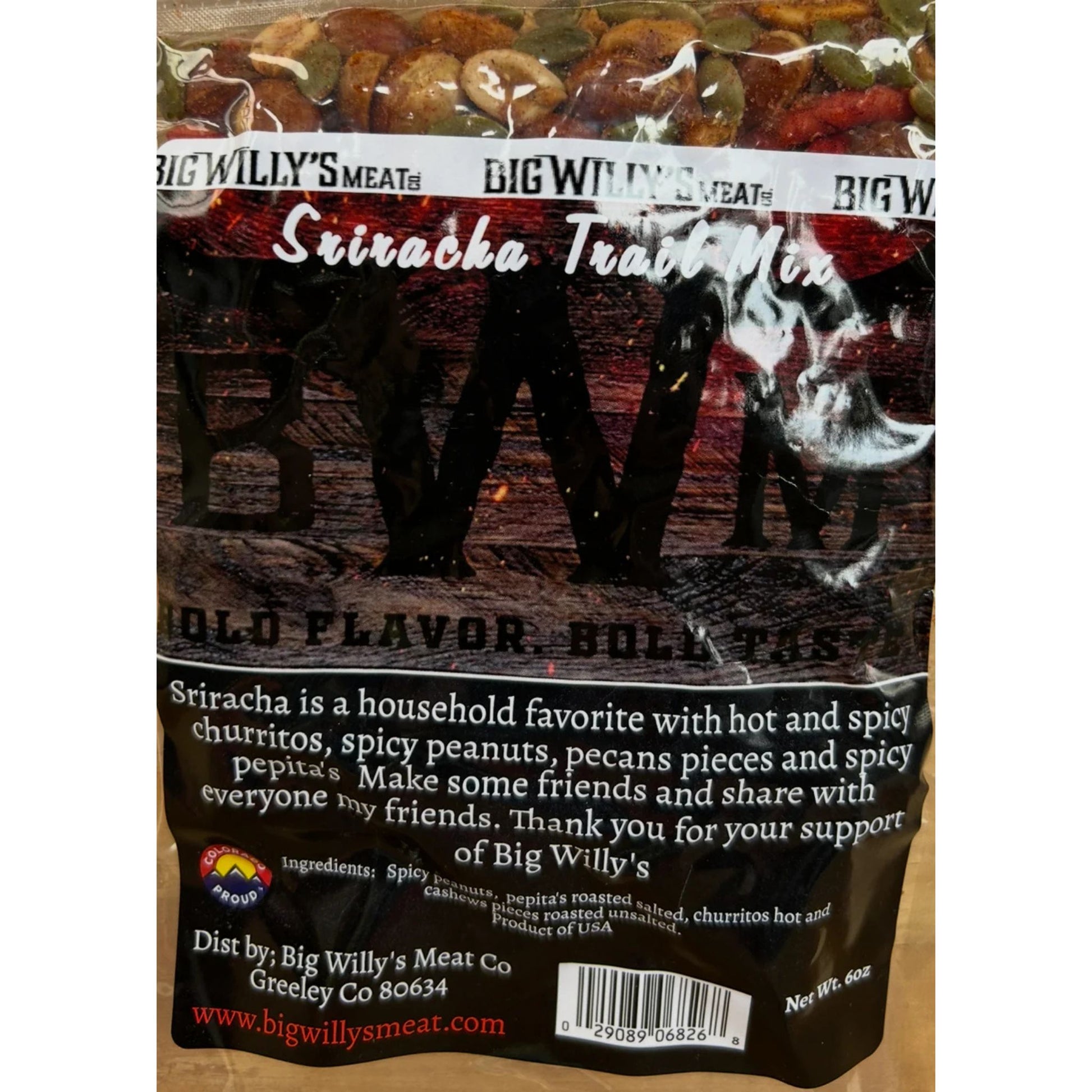 Packaged snack mix with visible branding on a wooden surface. Spicy Nut Snack Mix, Gourmet Spicy Snacks, Spicy Pepitas and Peanuts